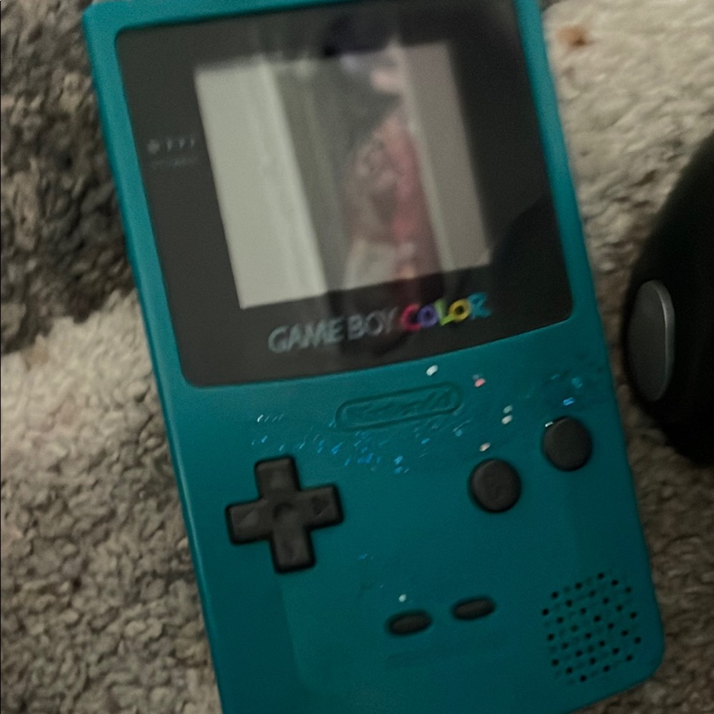 Teal Game Boy Color not new but is very workable has one game